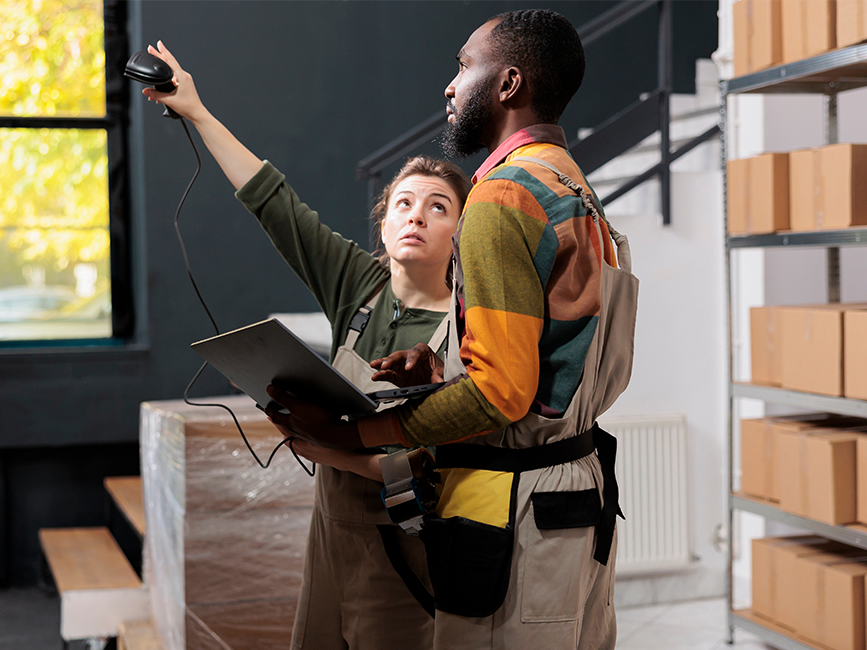 manager scanning packages barcode using store scanner