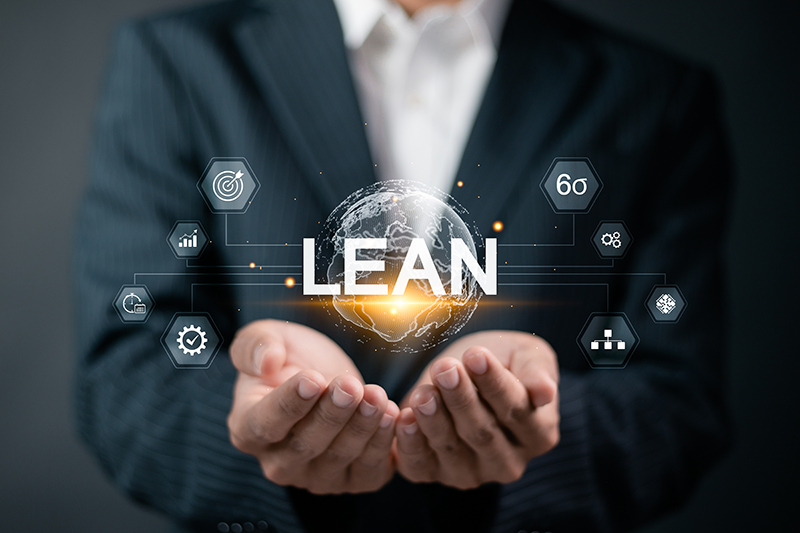 business person with hands holding LEAN word