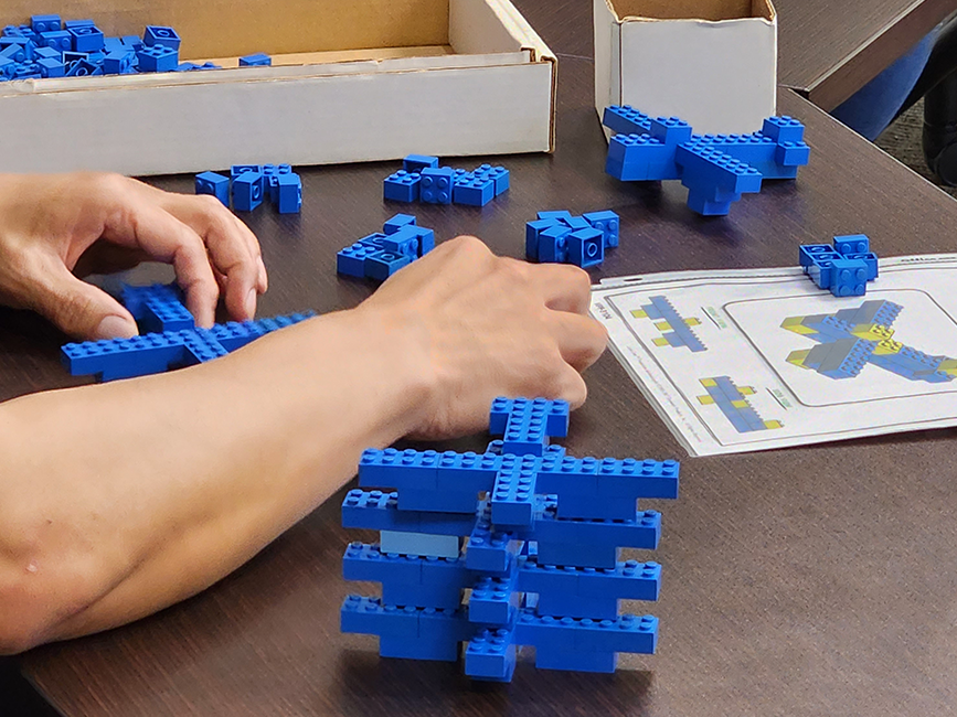 individual using blocks for management training exercise